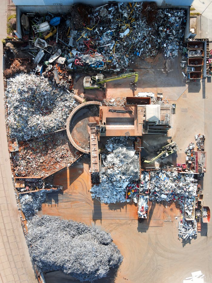 services-01 Aerial photo capturing a recycling facility in Regensburg, showcasing scrap and machinery.
