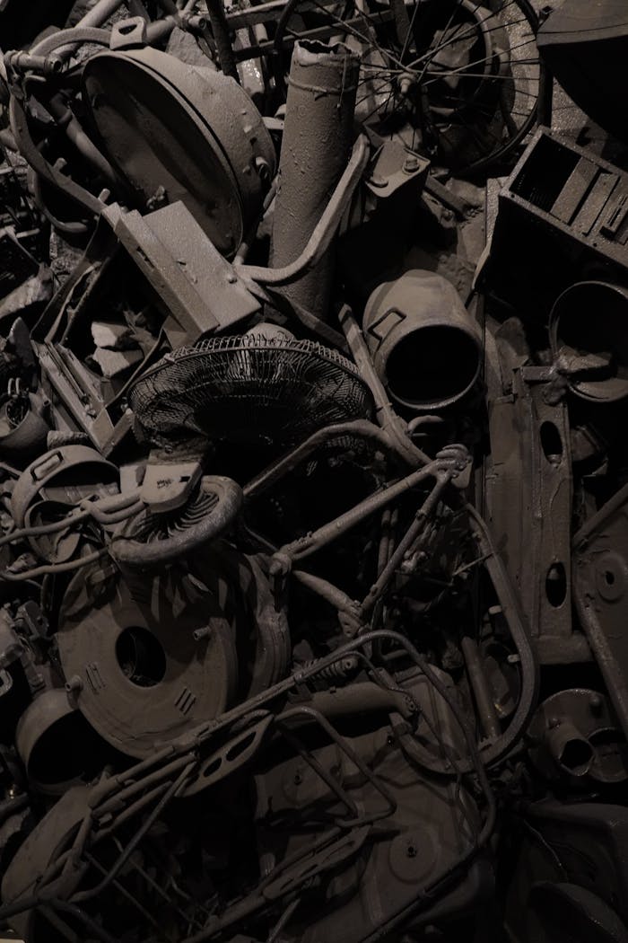gallery-6 Rusty collection of vintage mechanical junk in dark, moody lighting.