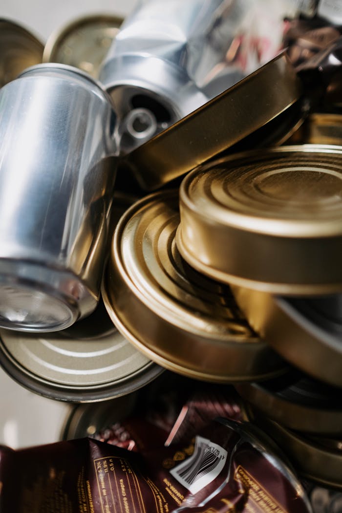 hero-img-02 Close-up of mixed aluminum and tin cans ready for recycling.